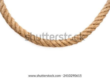 Thick rope on white background Royalty-Free Stock Photo #2410290615