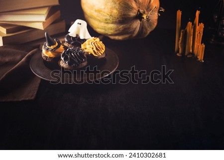 A image of halloween cupcakes and pumpkin