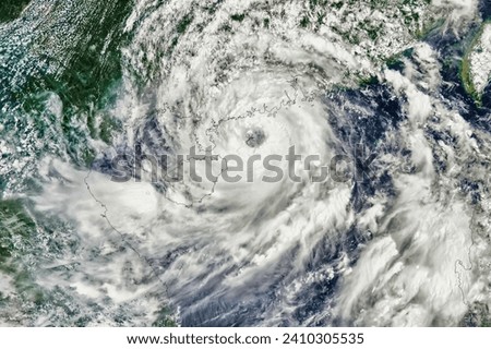 Pacific Storms Calvin and Talim. A tropical storm neared Hawaii in July 2023, while a typhoon farther west made landfall in China. Elements of this image furnished by NASA. Royalty-Free Stock Photo #2410305535