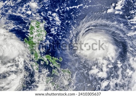 Rapid Intensification for Typhoon Chanthu. The potent storm in the Western Pacific intensified from a tropical depression to a super typhoon. Elements of this image furnished by NASA. Royalty-Free Stock Photo #2410305637