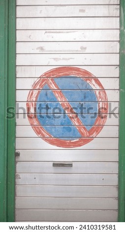 No parking painted sign in garage entrance