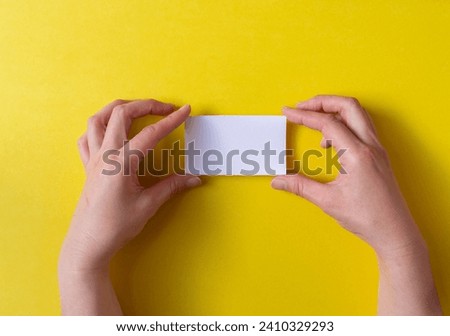 person holding a plain card
