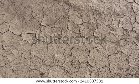 The dryness of the terrain is palpable, illustrating the harsh conditions and the lack of moisture. climate is changing Royalty-Free Stock Photo #2410337531