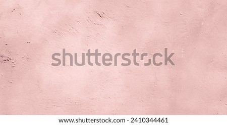 Pastel pink orange color stucco Wall Background. Abstract delicate pink backdrop. Rough artistic Surface plaster Texture. Beautiful vintage Wallpaper With Copy Space for Design