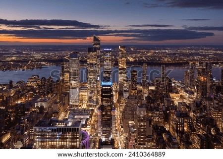 Aerial view of Midtown West Manhattan toward Hudson River with Hudson Yards skyscrapers at twilight. Chelsea and Hell's Kitchen neighborhood of New York City
