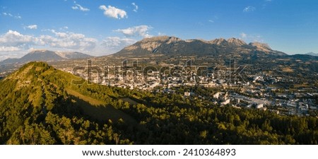 Aerial morning view of the City of Gap (capital of Hautes-Alpes department) in summer with Charance mountain. French Alps, France Royalty-Free Stock Photo #2410364893