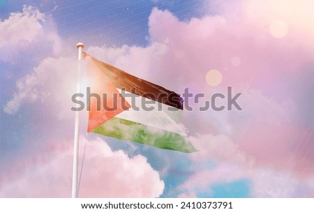 Palestine national flag waving in beautiful clouds.
