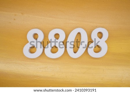 The golden yellow painted wood panel for the background, number 8808, is made from white painted wood.