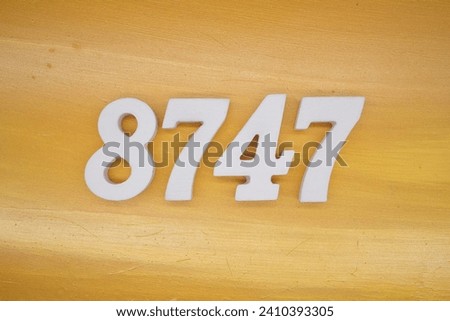 The golden yellow painted wood panel for the background, number 8747, is made from white painted wood.