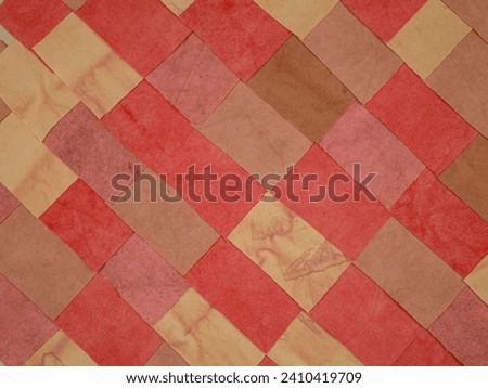 Handmade background in patchwork style with cotton fabric elements in red tones Royalty-Free Stock Photo #2410419709