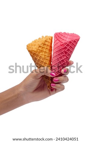Woman's hand holding empty wafer two cone for ice cream. Close up, High resolution product