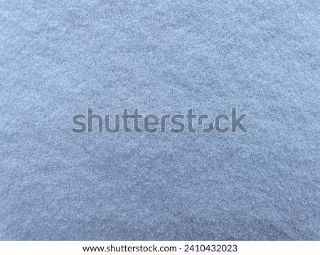 The snow froze on the ground in the season winter. Royalty-Free Stock Photo #2410432023