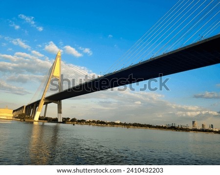 High bridge, bridge over the Chao Phraya River  Fixed with a large sling. It is for traveling for the convenience of traveling.  Big ships can sail through with blue sky and travel planning concepts