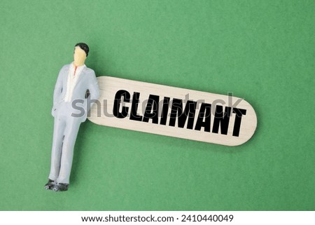 miniature and wooden people with the word claimant. the concept of demanding defense Royalty-Free Stock Photo #2410440049