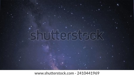 Astro photography in a desert nights cape with Milky Way galaxy. The background is stary celestial bodies in astronomy Royalty-Free Stock Photo #2410441969
