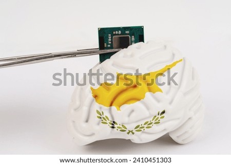 On a white background, a model of the brain with a picture of a flag - Cyprus, a microcircuit, a processor, is implanted into it. Close-up