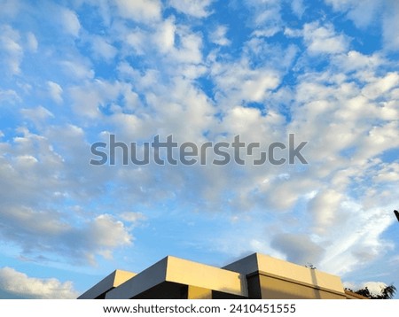 blue sky picture scattered white clouds Buildings that decorate the sky to life Nature and man-made things
