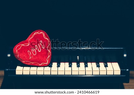 red heart on piano. music background
