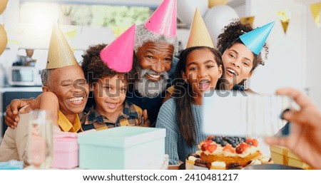 Happy birthday, phone and family in celebration for memory or picture together at home. Excited people or group smile for photography, capture or social media while bonding at party or event at house