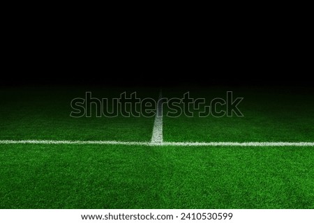 Soccer Stadium at night. Football and green field in the dark