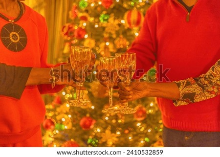 Friends get together to celebrate Christmas and the first day of Kwanzaa.