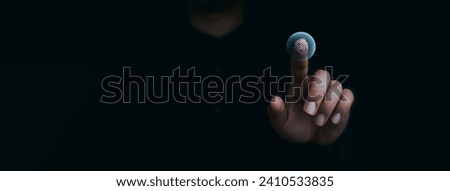 Blue fingerprint scan icon on virtual screen while finger scanning for security access with biometrics identification on dark. Cyber security, privacy data protection technology for business. Royalty-Free Stock Photo #2410533835