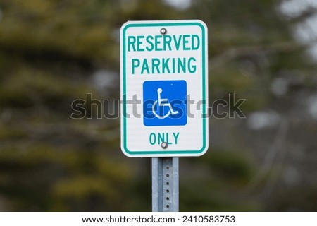 handicap sign reserves parking for handicap only has been mounted in a public park