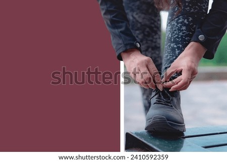Sneakers. close up of a woman tying shoelaces. Women's sneaker ready for outdoor running in the park or forest.