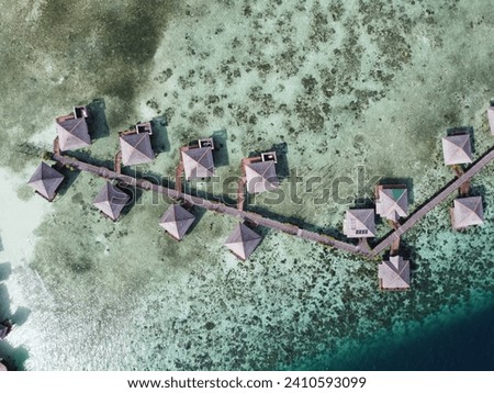 Drone view of Mabul Island, the base for diving in Sipadan Island, Sabah state in Malaysia. Royalty-Free Stock Photo #2410593099