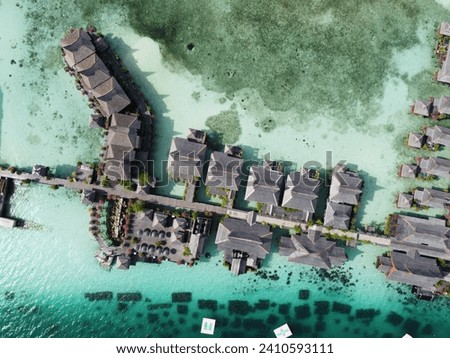 Drone view of Mabul Island, the base for diving in Sipadan Island, Sabah state in Malaysia. Royalty-Free Stock Photo #2410593111
