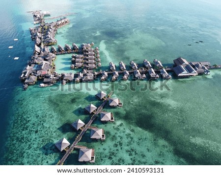 Drone view of Mabul Island, the base for diving in Sipadan Island, Sabah state in Malaysia. Royalty-Free Stock Photo #2410593131