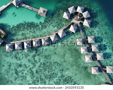 Drone view of Mabul Island, the base for diving in Sipadan Island, Sabah state in Malaysia. Royalty-Free Stock Photo #2410593135