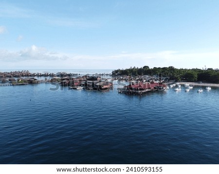 Drone view of Mabul Island, the base for diving in Sipadan Island, Sabah state in Malaysia. Royalty-Free Stock Photo #2410593155
