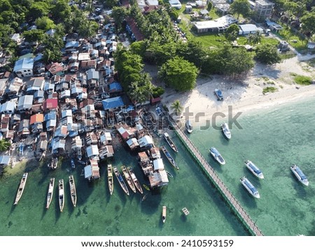 Drone view of Mabul Island, the base for diving in Sipadan Island, Sabah state in Malaysia. Royalty-Free Stock Photo #2410593159