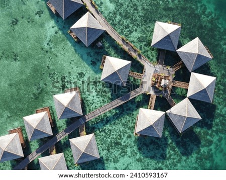 Drone view of Mabul Island, the base for diving in Sipadan Island, Sabah state in Malaysia. Royalty-Free Stock Photo #2410593167