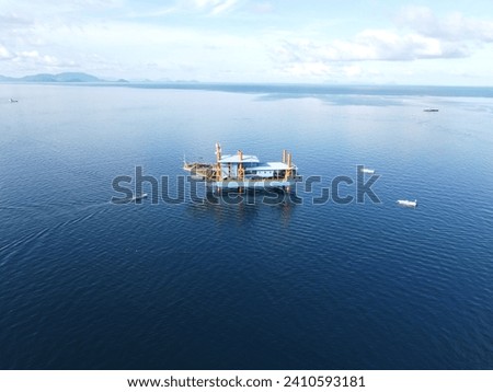 Drone view of Mabul Island, the base for diving in Sipadan Island, Sabah state in Malaysia. Royalty-Free Stock Photo #2410593181