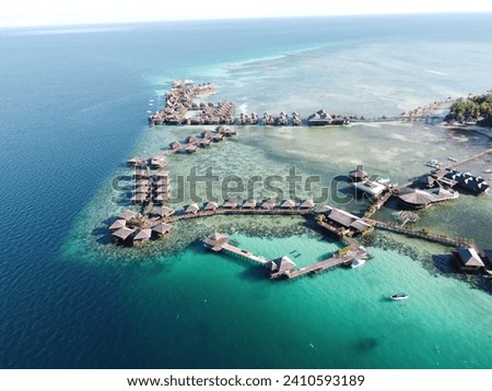Drone view of Mabul Island, the base for diving in Sipadan Island, Sabah state in Malaysia. Royalty-Free Stock Photo #2410593189