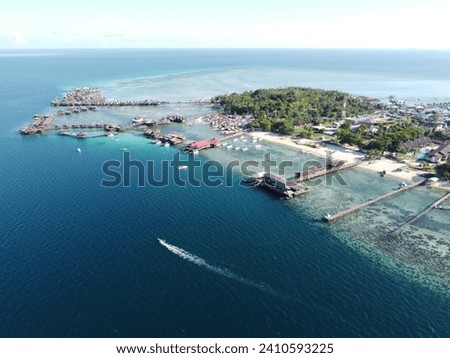Drone view of Mabul Island, the base for diving in Sipadan Island, Sabah state in Malaysia. Royalty-Free Stock Photo #2410593225