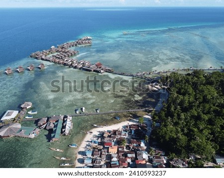Drone view of Mabul Island, the base for diving in Sipadan Island, Sabah state in Malaysia. Royalty-Free Stock Photo #2410593237