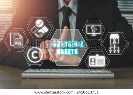 Intangible assets concept, Businessman hand touching intangible assets icon on virtual screen. Royalty-Free Stock Photo #2410613751