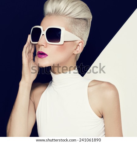 Blonde model in trendy Sunglasses with stylish Haircut. Fashion photo