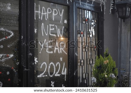  Welcome 2024 on cafe window . New year concept.