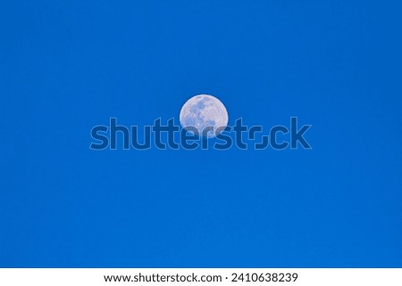 Day moon with light blue background
