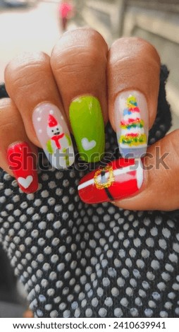 Christmas Nails Gel with draw some christmas pic such as : santa's cloth, snowman, christmas tree, with colours red, green, white and yellow.