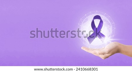 Hand hold purple ribbon for World cancer awareness day  banner and background. 