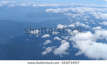 view of clouds in the sky from an airplane
