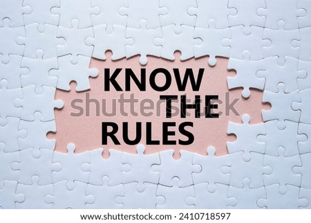 Know the rules symbol. Concept words Know the rules on white puzzle. Beautiful pink background. Business and Know the rules concept. Copy space.