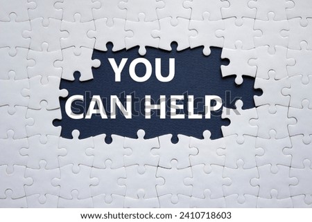 You can help symbol. Concept words You can help on white puzzle. Beautiful deep blue background. Business and You can help concept. Copy space.