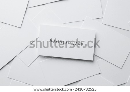 Business cards on white background, top view
