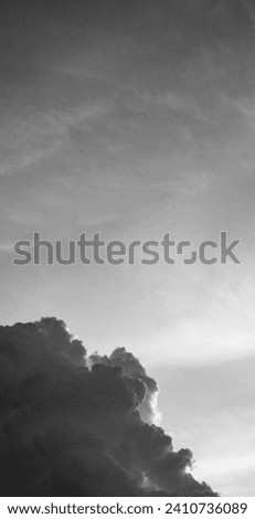 Tranquil Mountain Landscape with Serene Sky and Cloud Silhouettes Serene mountain landscape with silhouette and blue sky. Royalty-Free Stock Photo #2410736089